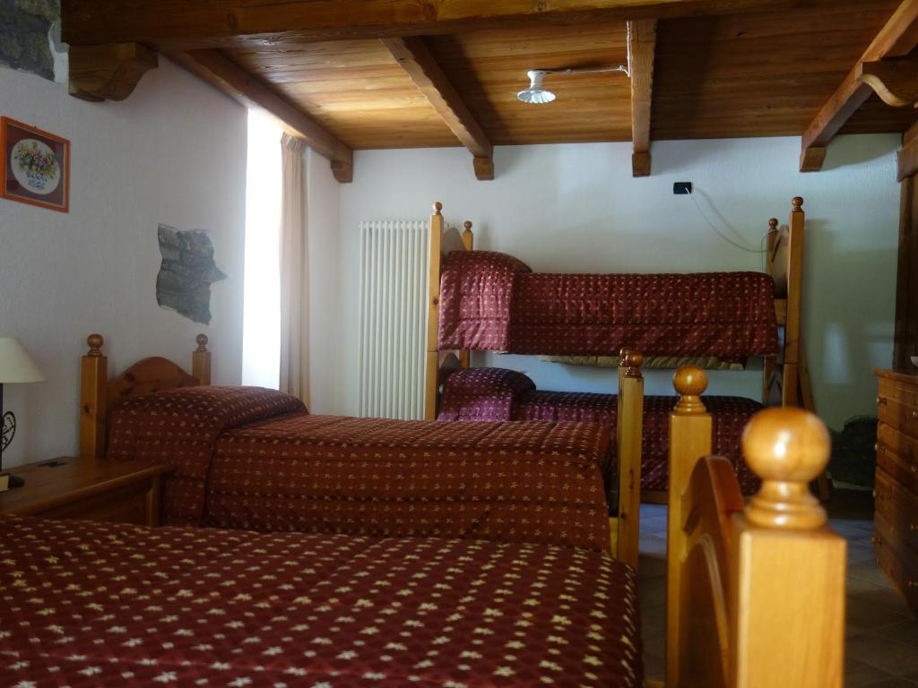 Postel nebo postele na pokoji v ubytování Auberge Lou Créton di Lui Hostel