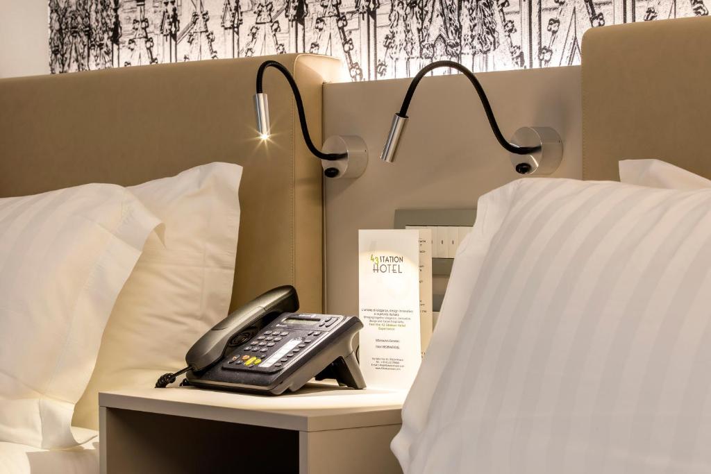 Postel nebo postele na pokoji v ubytování 43 Station Hotel