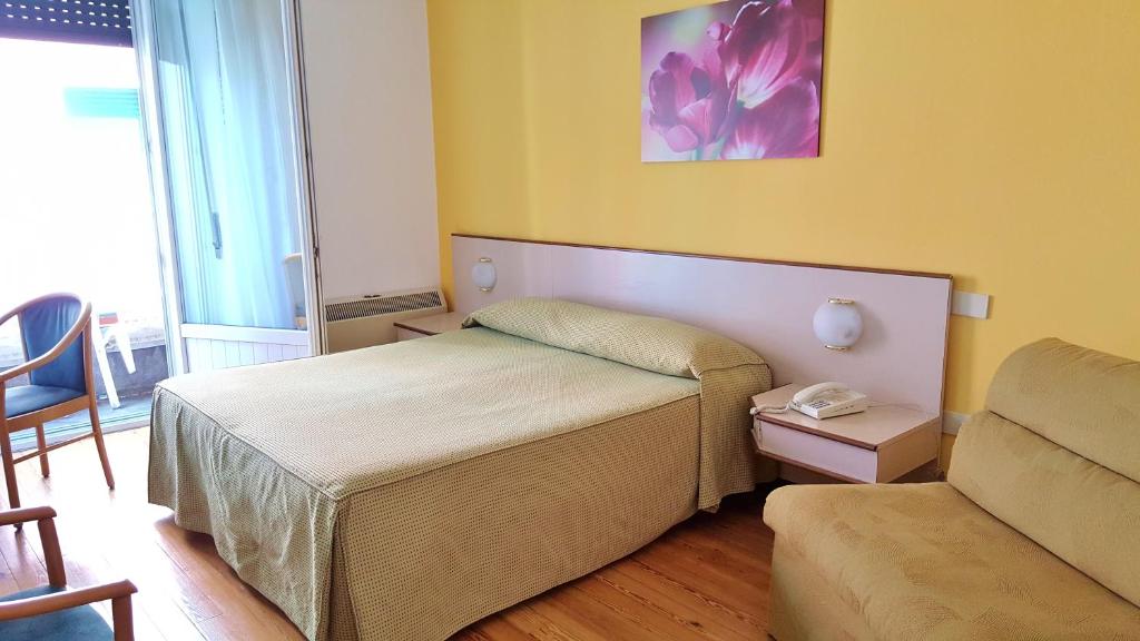 Postel nebo postele na pokoji v ubytování Hotel Italie et Suisse