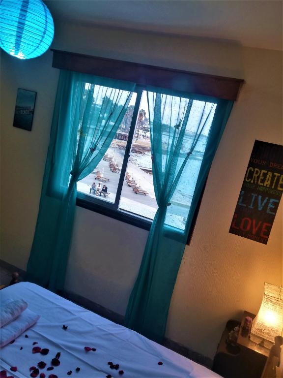 Postel nebo postele na pokoji v ubytování 777 Beach Guesthouse