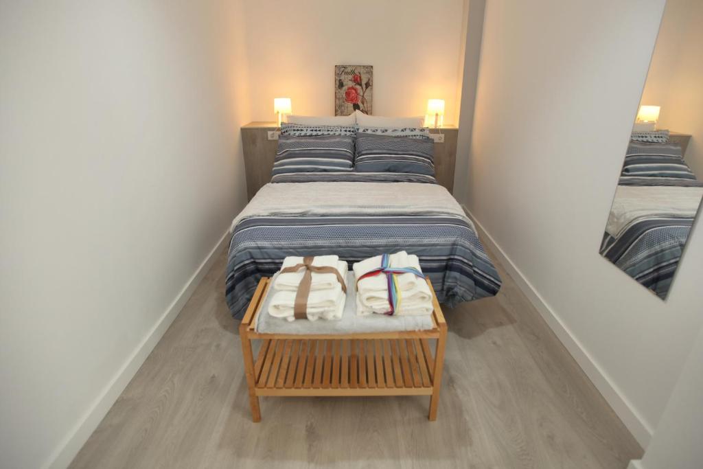 A bed or beds in a room at Noches de ensueño