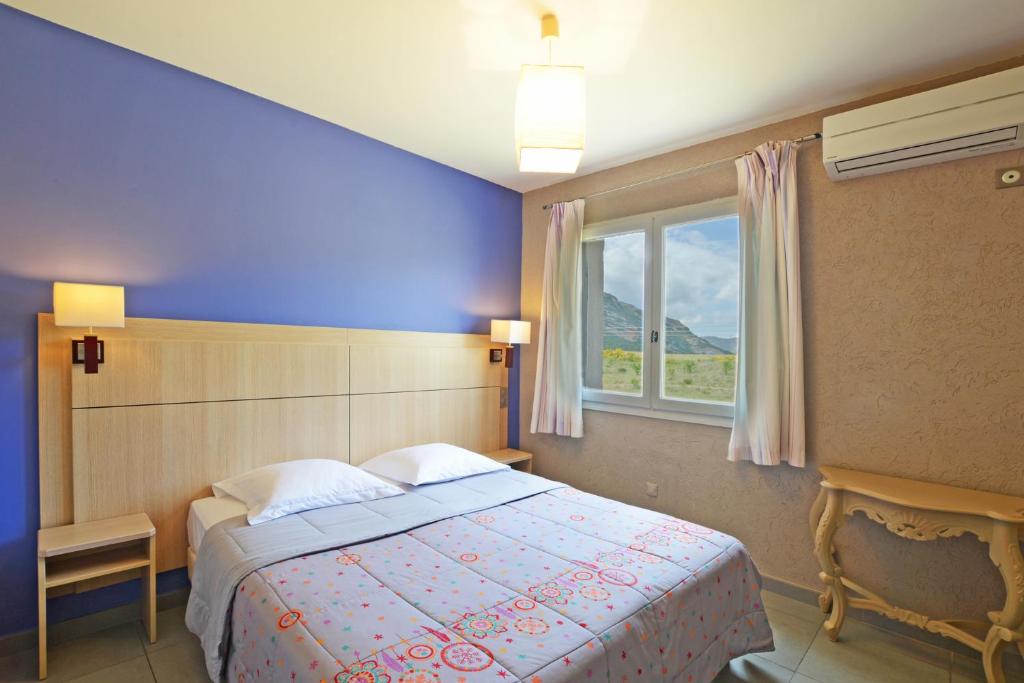 Postel nebo postele na pokoji v ubytování Hôtel la Palma