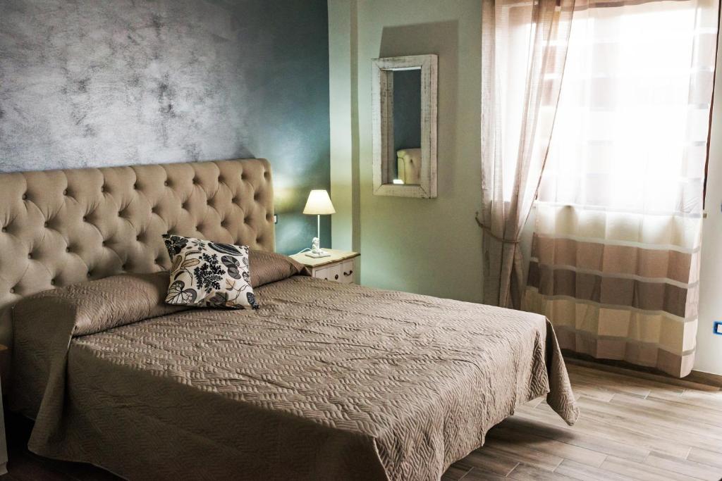 Postel nebo postele na pokoji v ubytování INFORMIS B&B