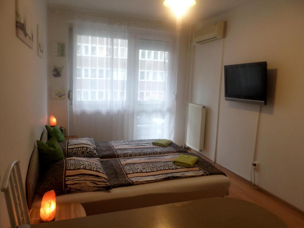 A bed or beds in a room at Apartments Leslie