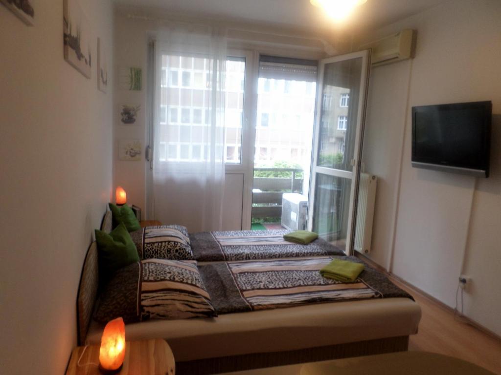A bed or beds in a room at Apartments Leslie