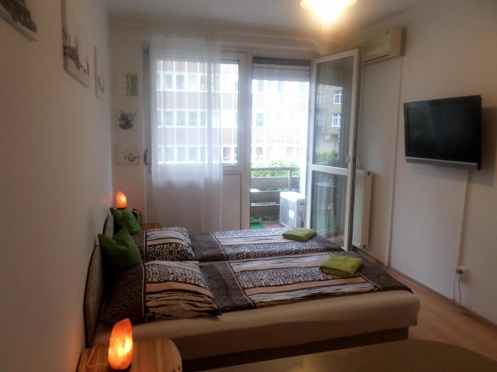 A bed or beds in a room at Apartments Leslie