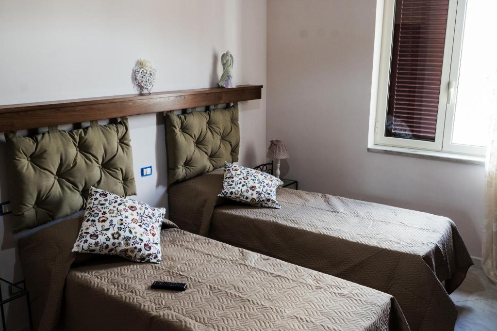 Postel nebo postele na pokoji v ubytování INFORMIS B&B