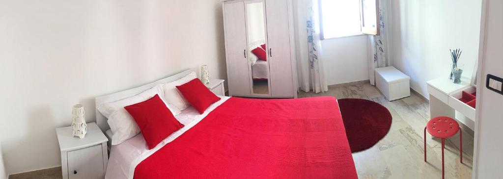 Łóżko lub łóżka w pokoju w obiekcie B&B Scilla Mare