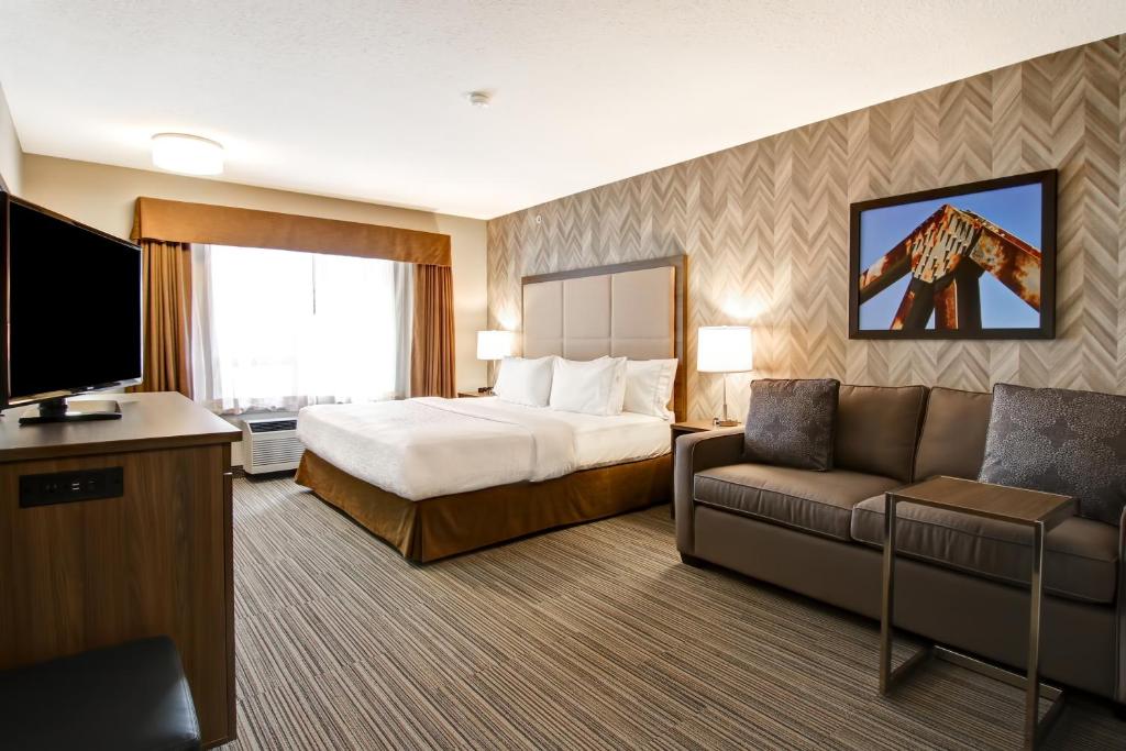 Een bed of bedden in een kamer bij Canalta Brooks