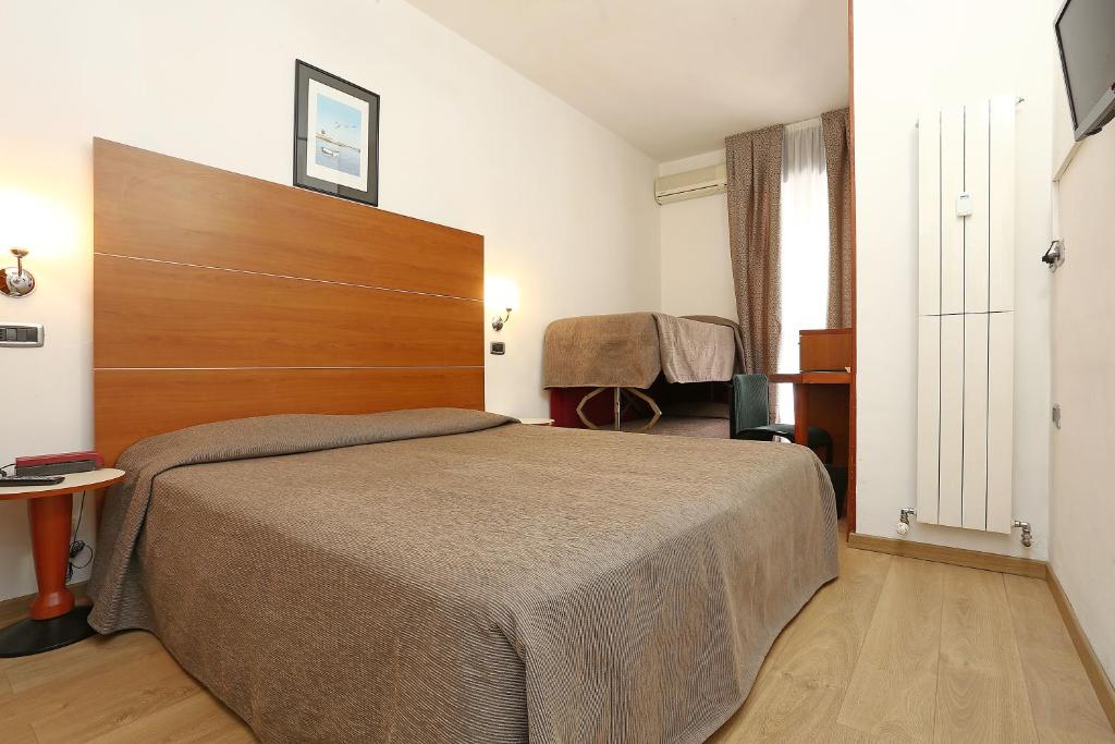 Postel nebo postele na pokoji v ubytování Hotel Corticella