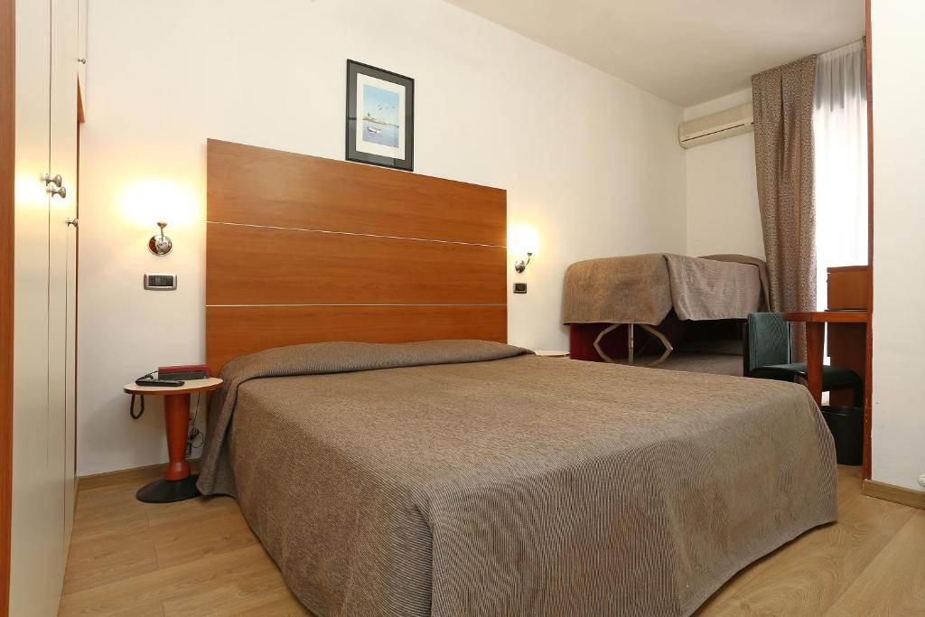 Postel nebo postele na pokoji v ubytování Hotel Corticella