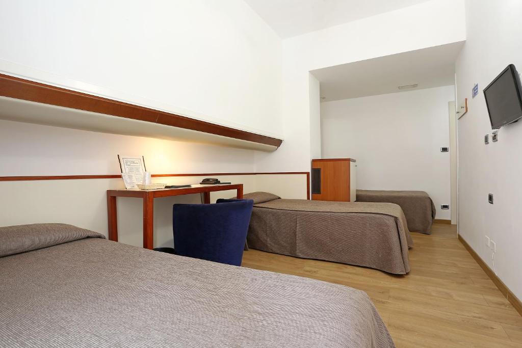 Postel nebo postele na pokoji v ubytování Hotel Corticella