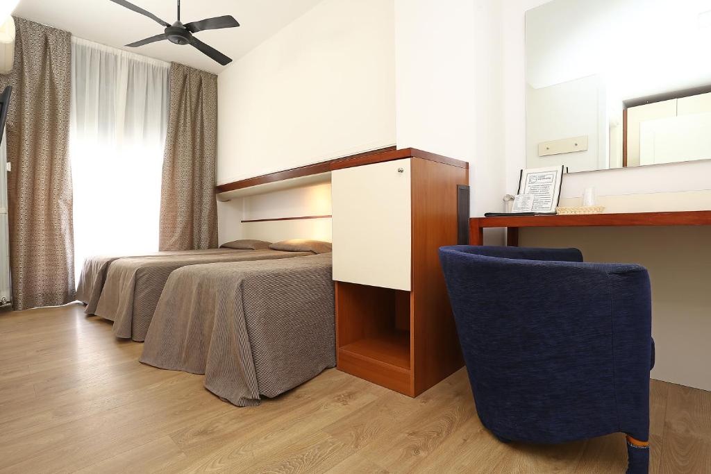 Postel nebo postele na pokoji v ubytování Hotel Corticella