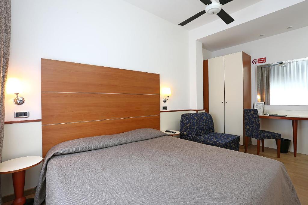 Postel nebo postele na pokoji v ubytování Hotel Corticella
