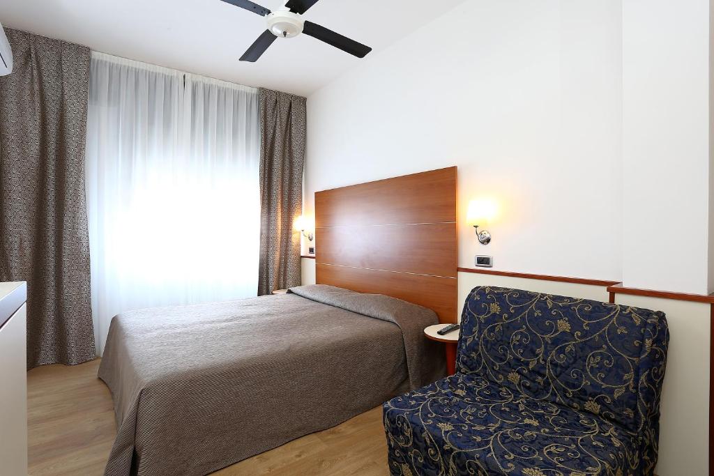 Postel nebo postele na pokoji v ubytování Hotel Corticella