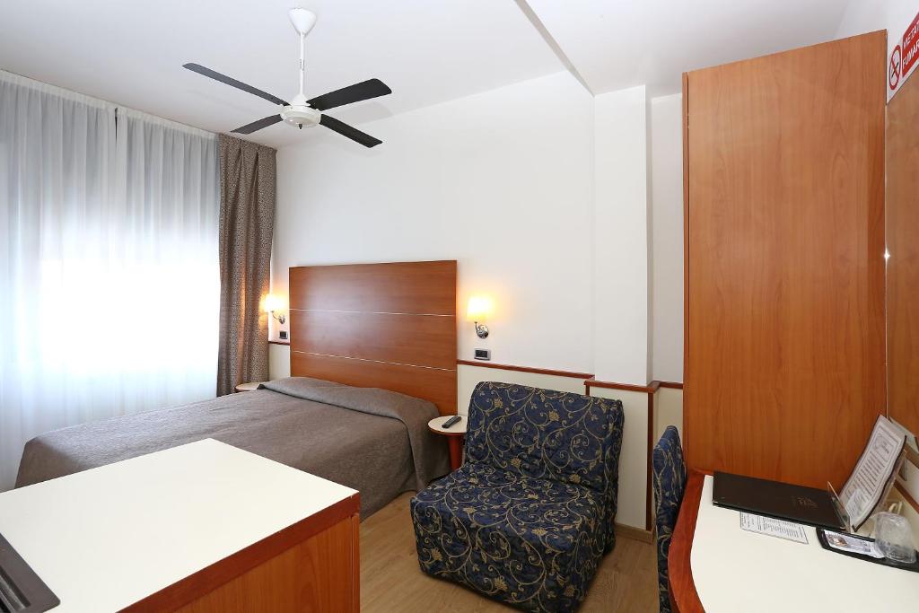 Postel nebo postele na pokoji v ubytování Hotel Corticella
