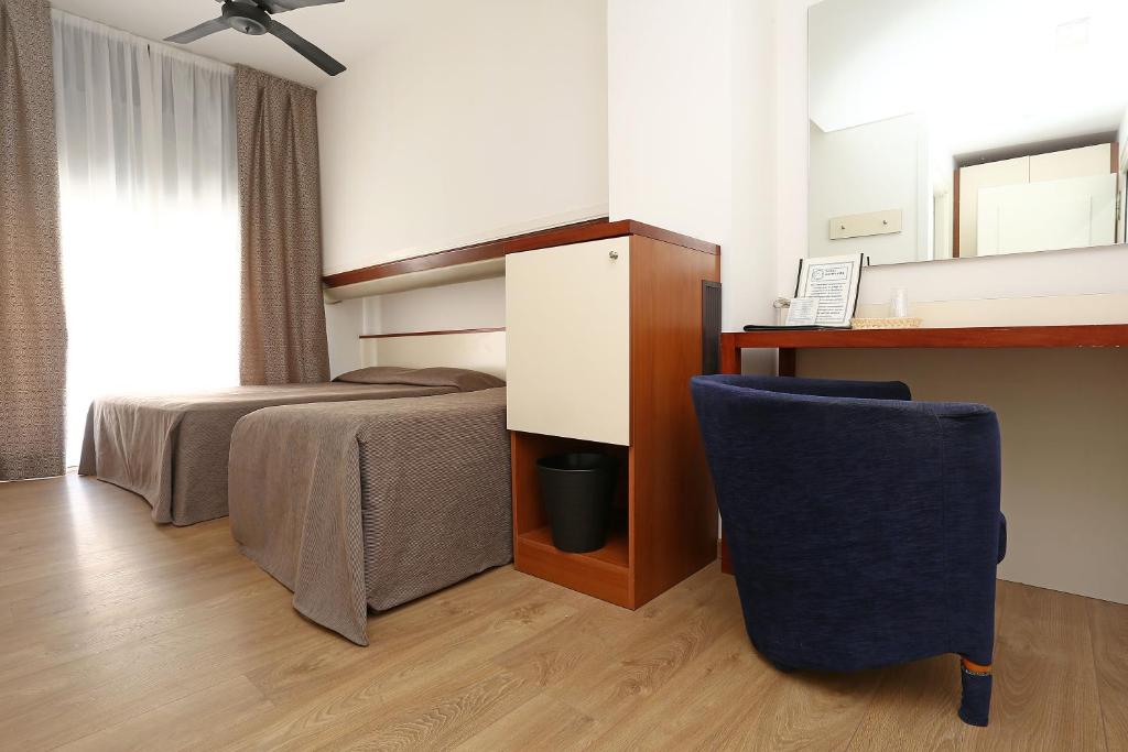 Postel nebo postele na pokoji v ubytování Hotel Corticella