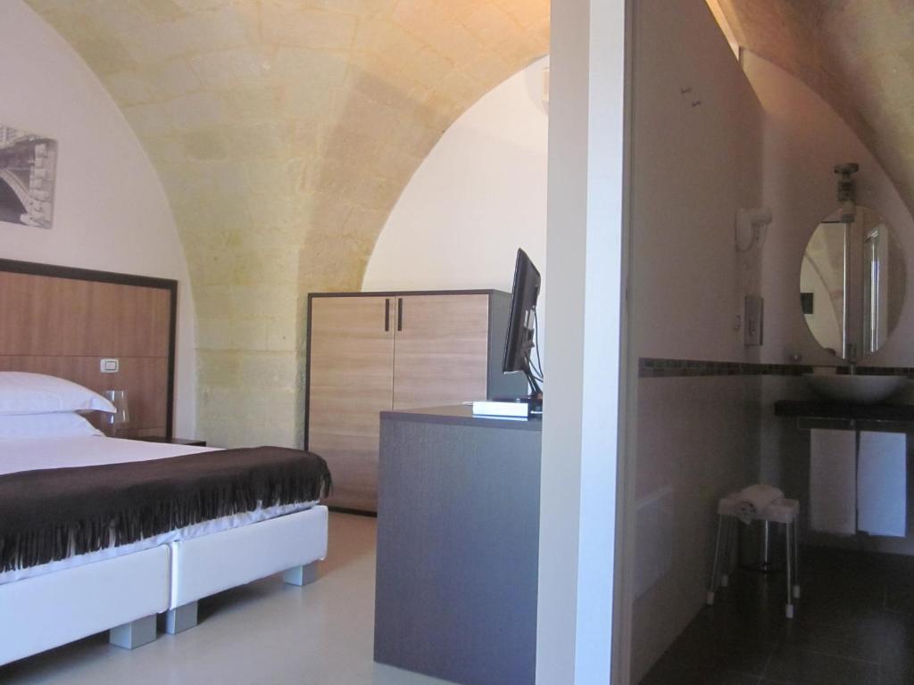 Postel nebo postele na pokoji v ubytování Albergo Del Sole
