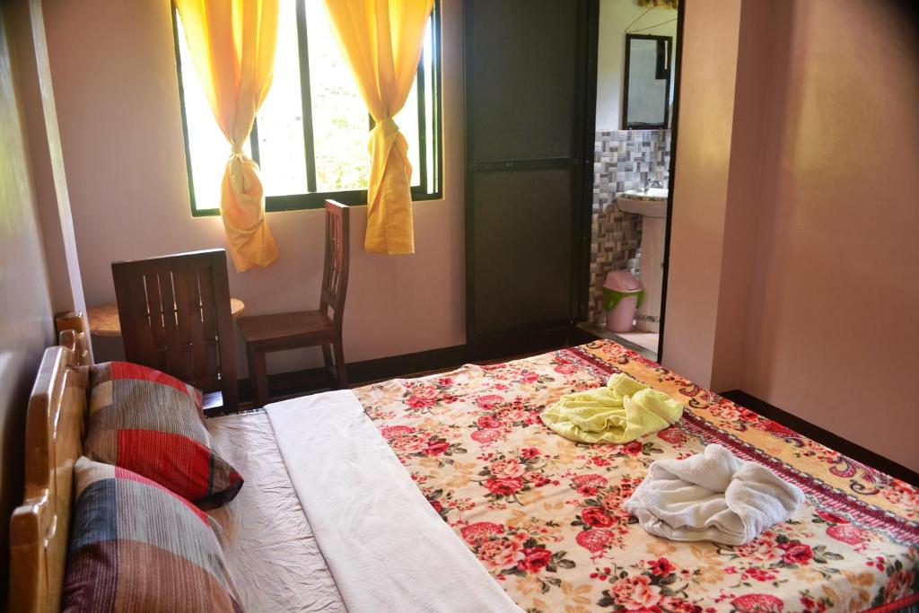 Postel nebo postele na pokoji v ubytování Banaue Greenfields Inn