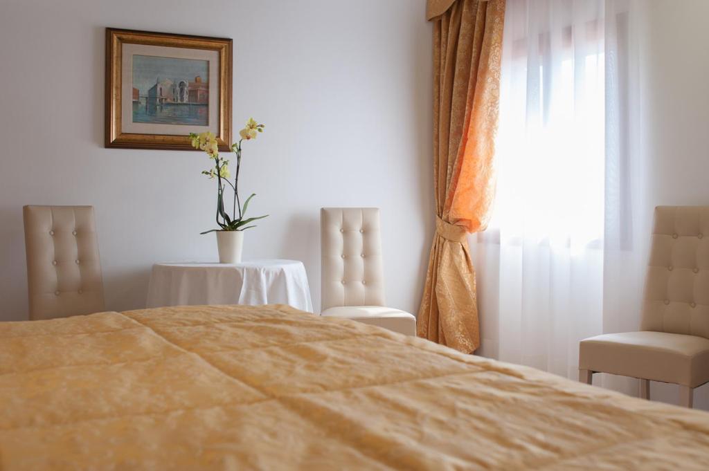 Postel nebo postele na pokoji v ubytování Ca' Cappellis
