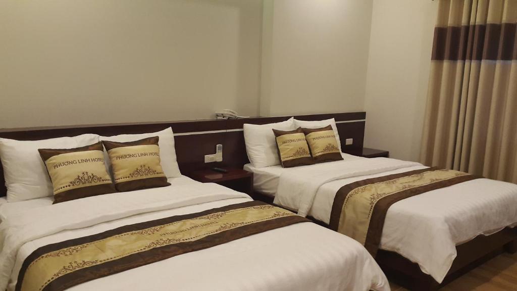 Postel nebo postele na pokoji v ubytování Phuong Linh Hotel