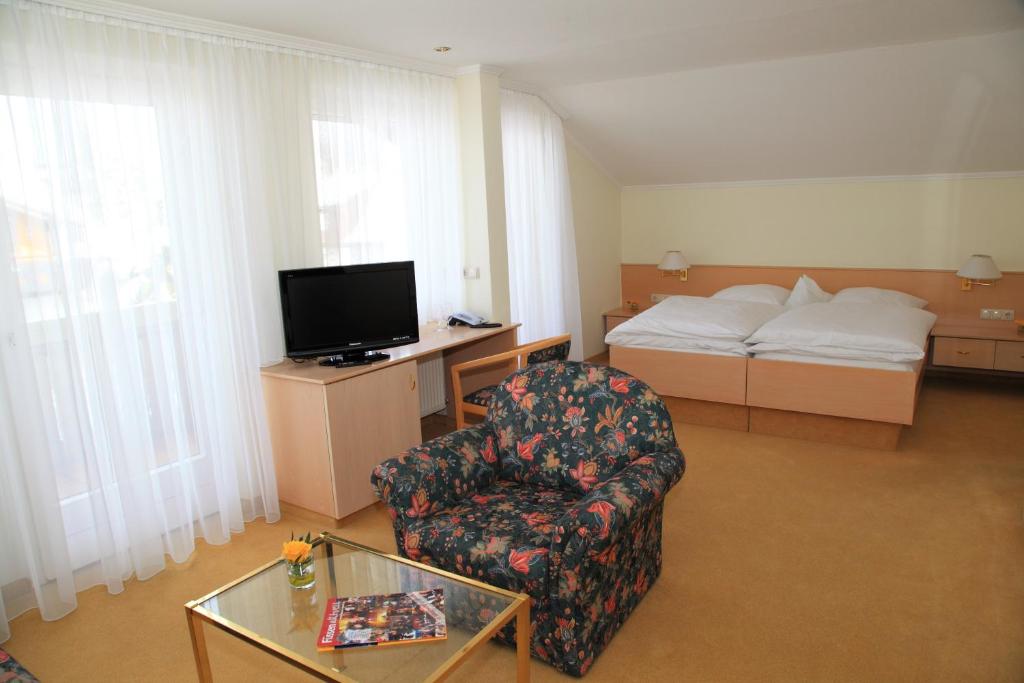 Postel nebo postele na pokoji v ubytování Hotel Christine