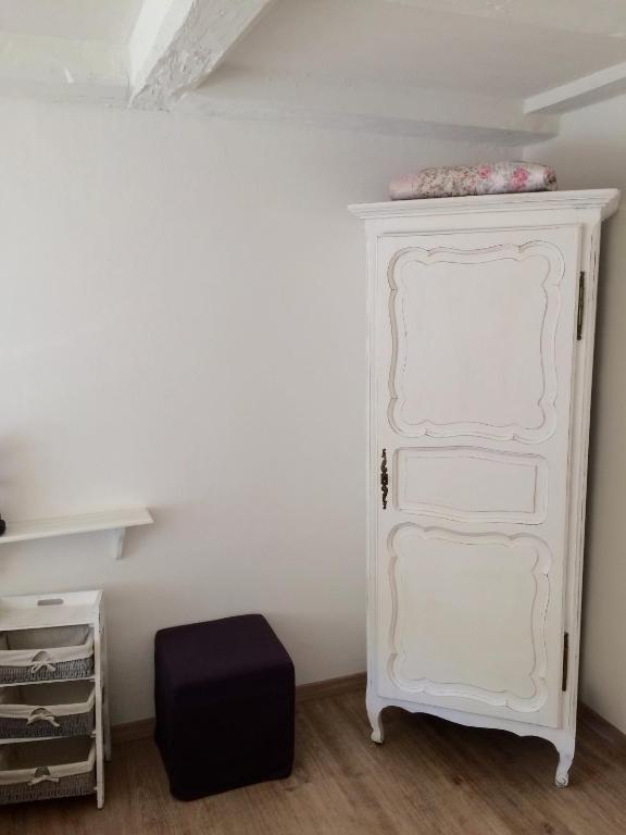 a white dresser in a room with a shelf at Bed and Breakfast 57 in Asuel