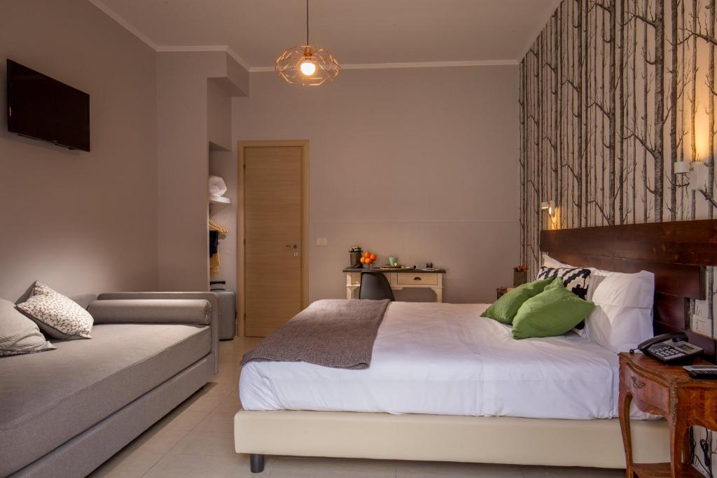 Postel nebo postele na pokoji v ubytování Urban Garden Hotel