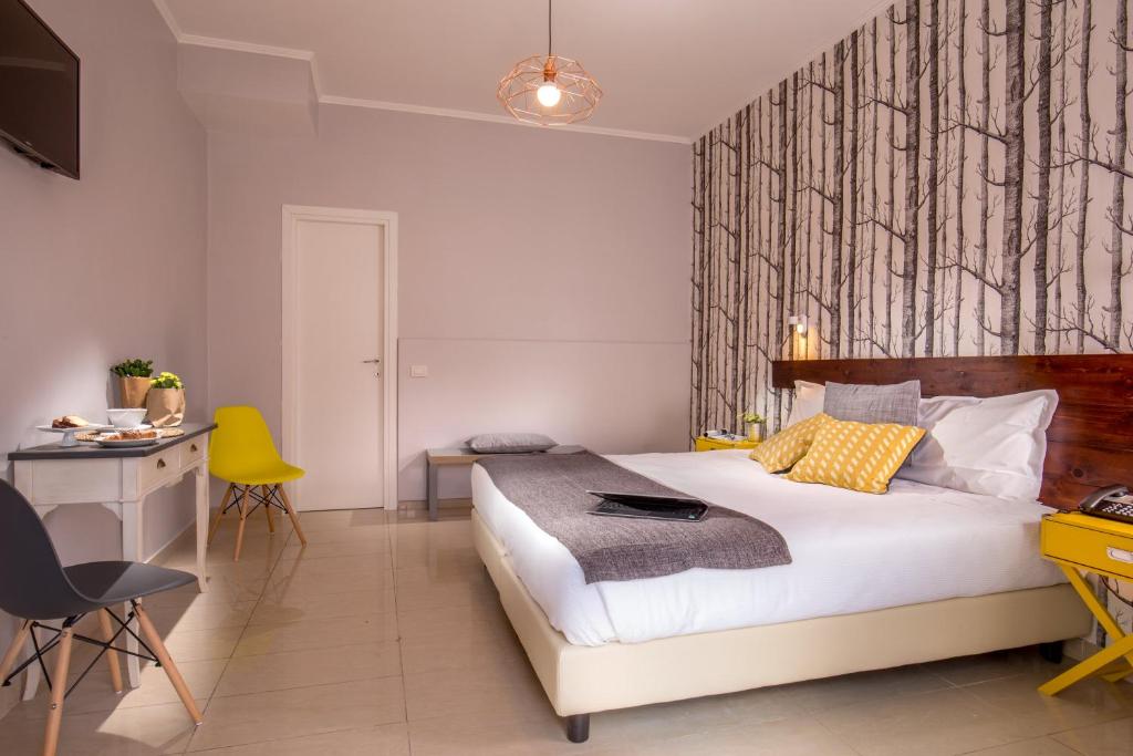Postel nebo postele na pokoji v ubytování Urban Garden Hotel