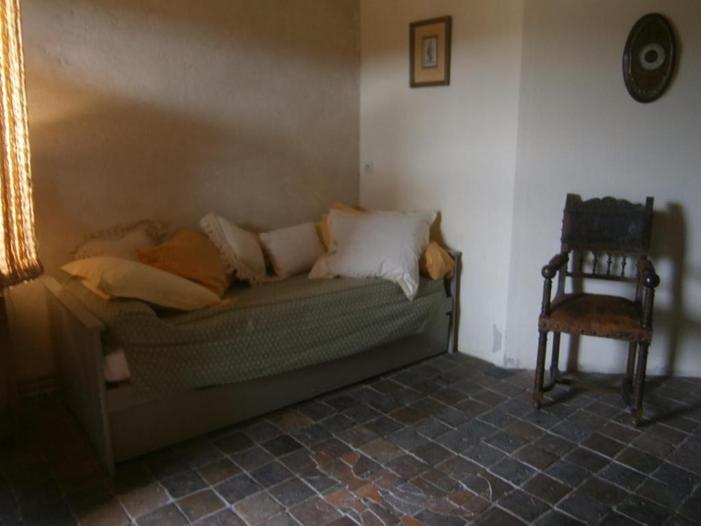 a living room with a couch and a chair at Chateau de Chémery in Chémery