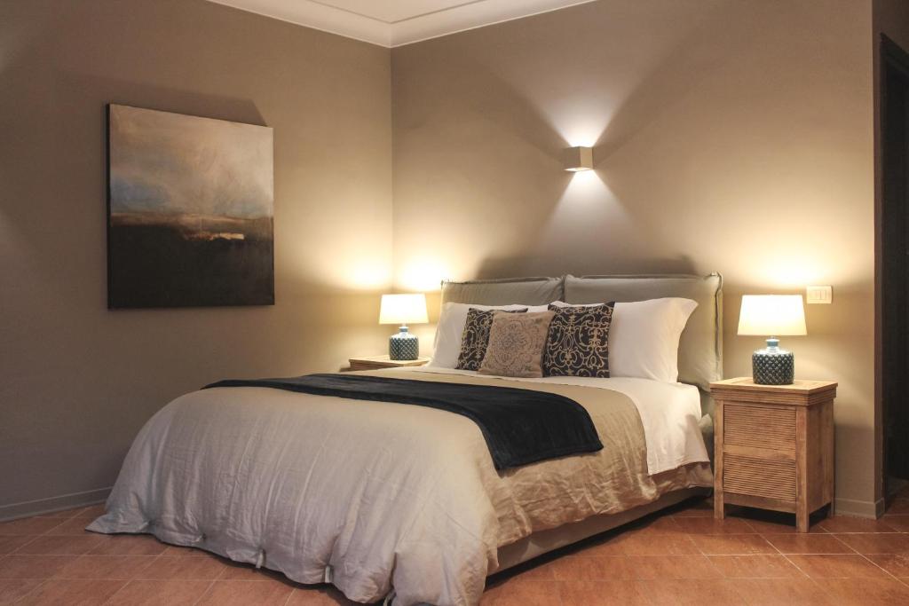 Postel nebo postele na pokoji v ubytování B&B Palazzo Bibirria