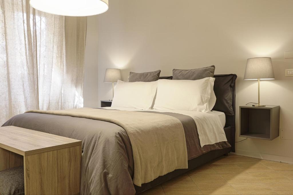 Postel nebo postele na pokoji v ubytování B&B Palazzo Bibirria