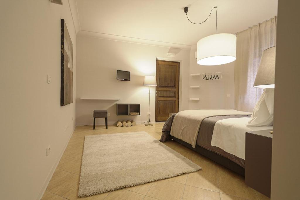Postel nebo postele na pokoji v ubytování B&B Palazzo Bibirria