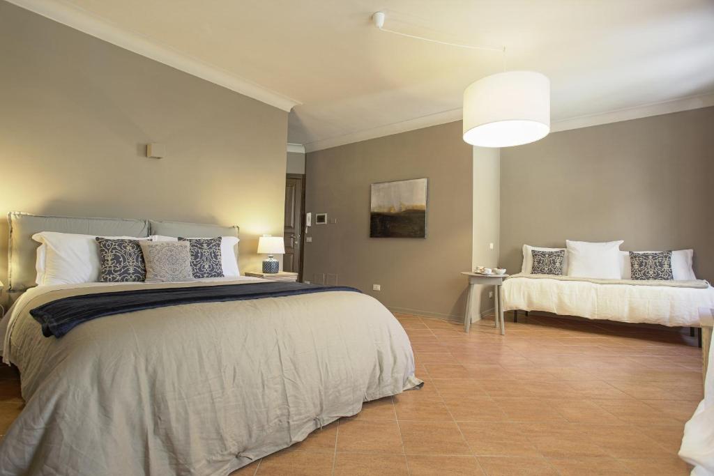 Postel nebo postele na pokoji v ubytování B&B Palazzo Bibirria