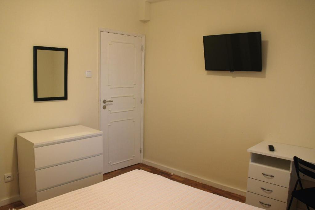 TV a/nebo společenská místnost v ubytování MicroRent Rooms