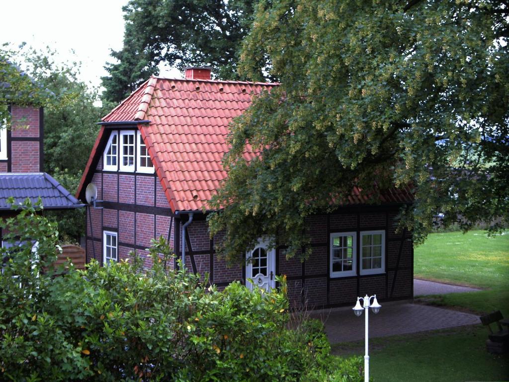 a small house with a red roof at Landhaus von Frieling in Soltau