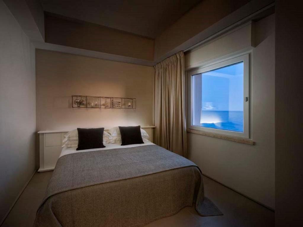 Кровать или кровати в номере Il Fogliano Hotel New Life