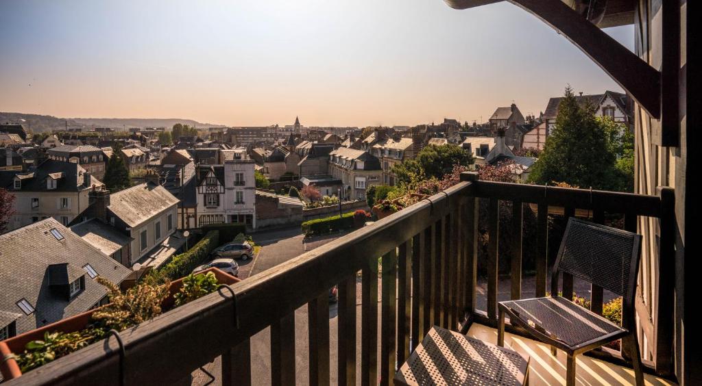 a view of a city from a balcony at Best Western Plus Hostellerie Du Vallon in Trouville-sur-Mer