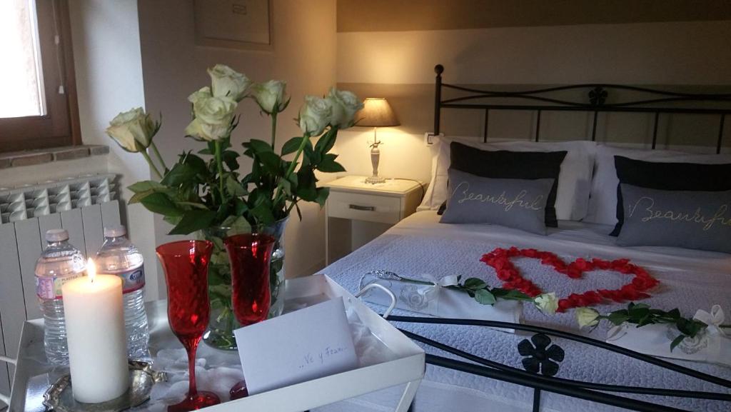 Postel nebo postele na pokoji v ubytování B&B Ronco degli Ulivi