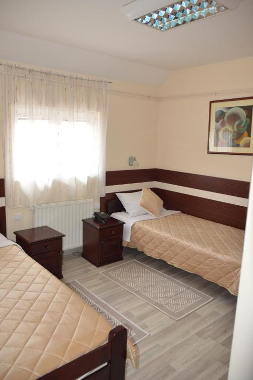 Postel nebo postele na pokoji v ubytování Hotel Čile