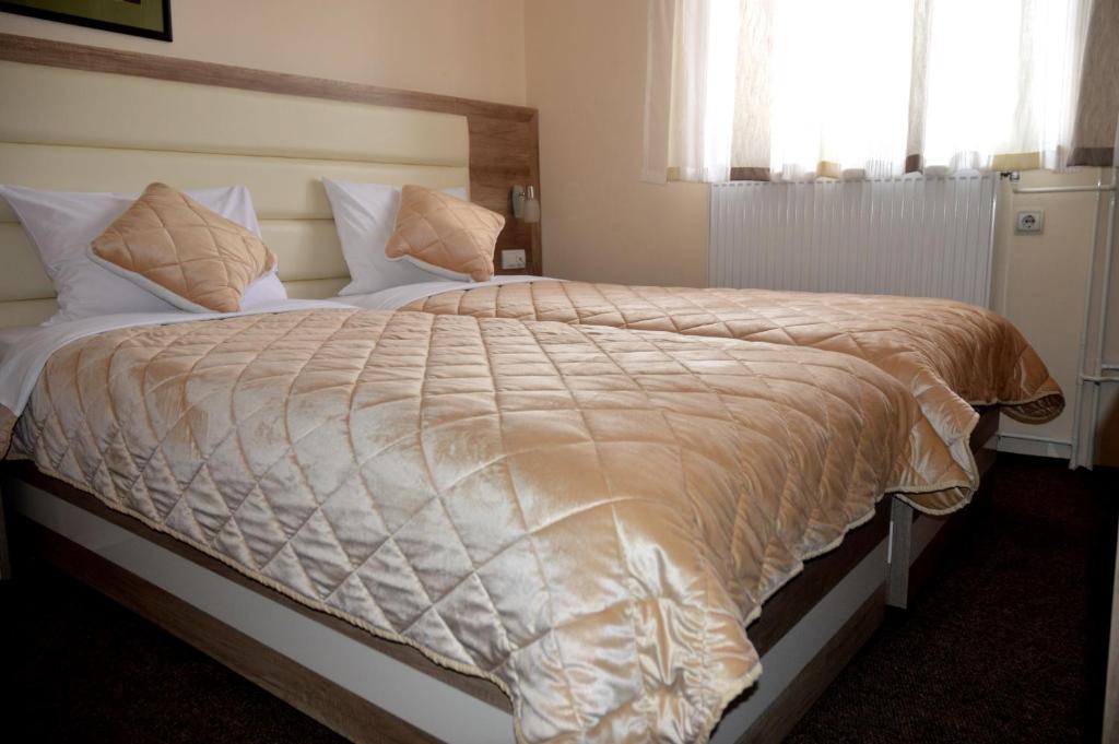 Postel nebo postele na pokoji v ubytování Hotel Čile