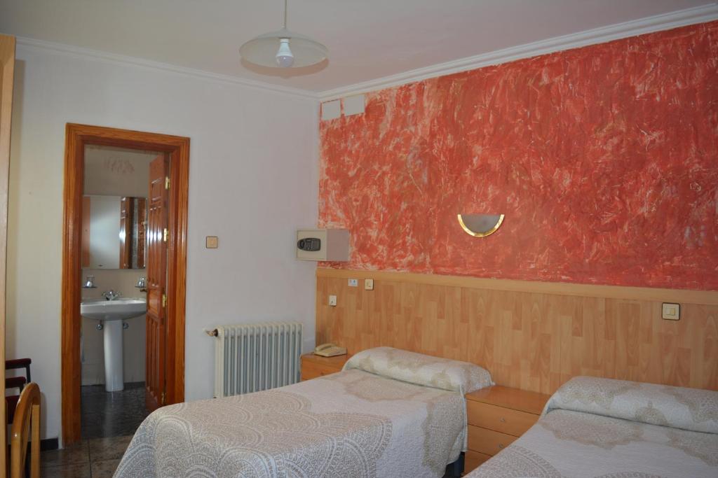 Postel nebo postele na pokoji v ubytování Hostal Manolete
