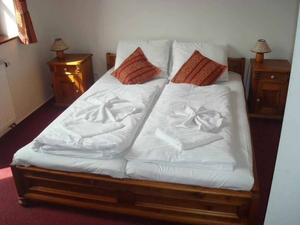 Łóżko lub łóżka w pokoju w obiekcie Sport hotel POMI