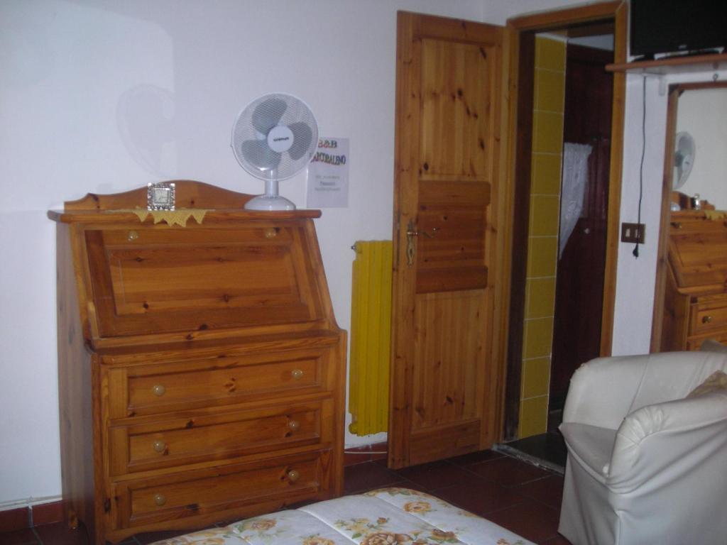 Postel nebo postele na pokoji v ubytování B&B L'Arcobaleno