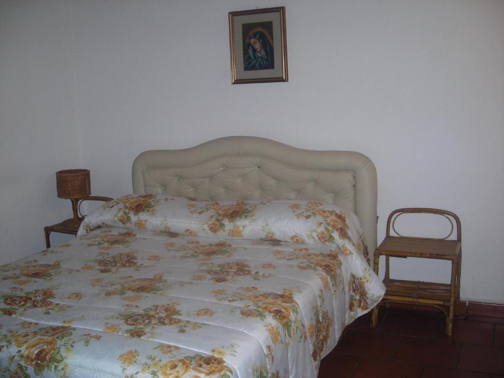Postel nebo postele na pokoji v ubytování B&B L'Arcobaleno