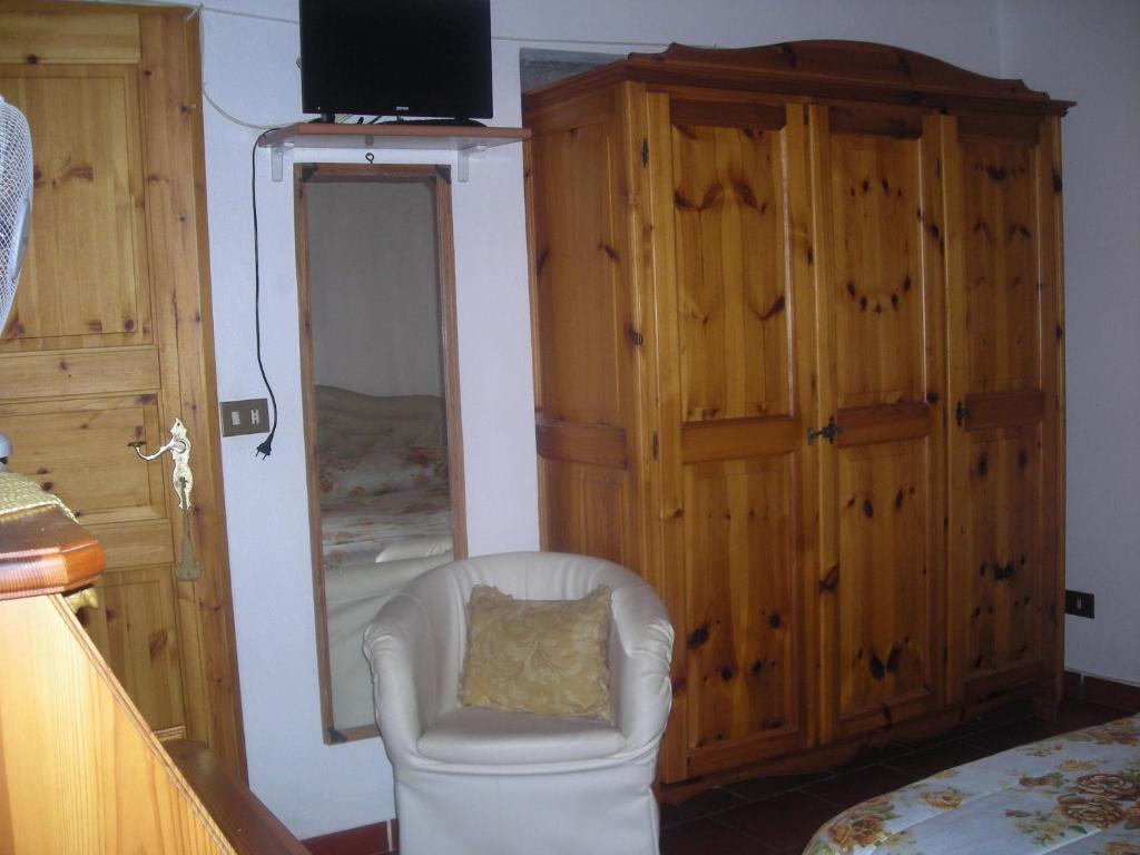 Postel nebo postele na pokoji v ubytování B&B L'Arcobaleno