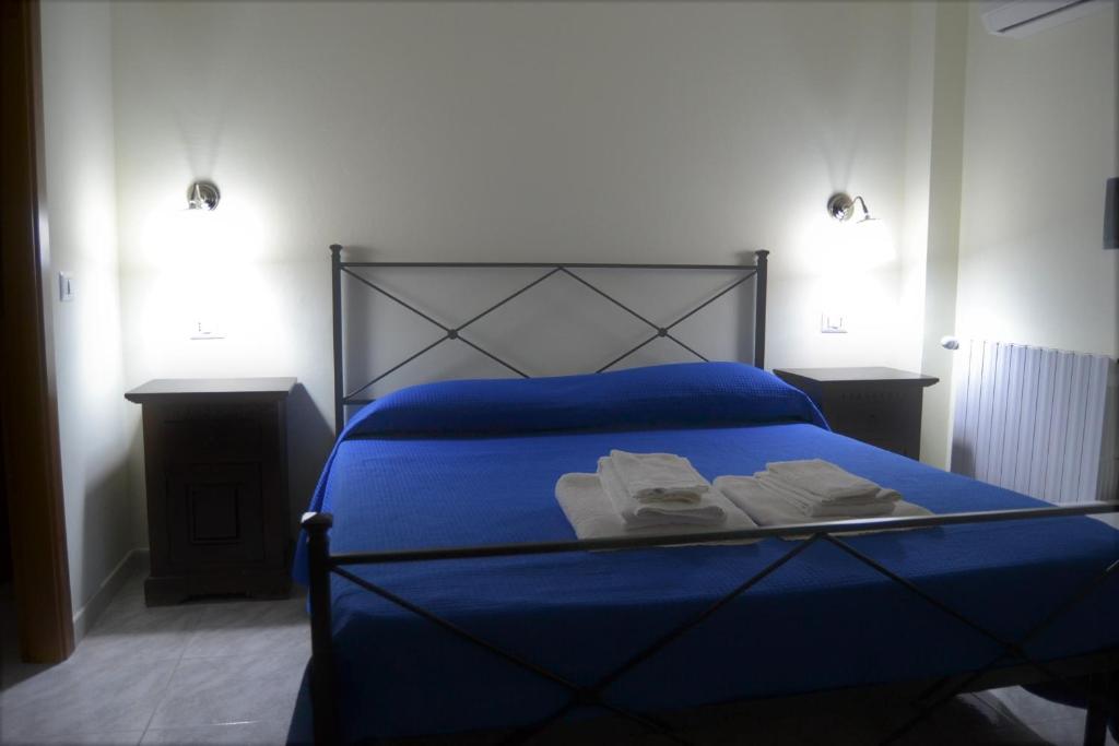 Postel nebo postele na pokoji v ubytování Guesthouse Holiday Formia beach