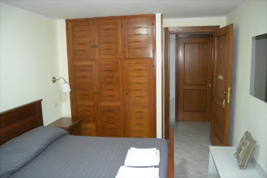 Postel nebo postele na pokoji v ubytování Guesthouse Holiday Formia beach