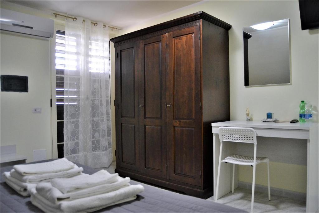 Postel nebo postele na pokoji v ubytování Guesthouse Holiday Formia beach
