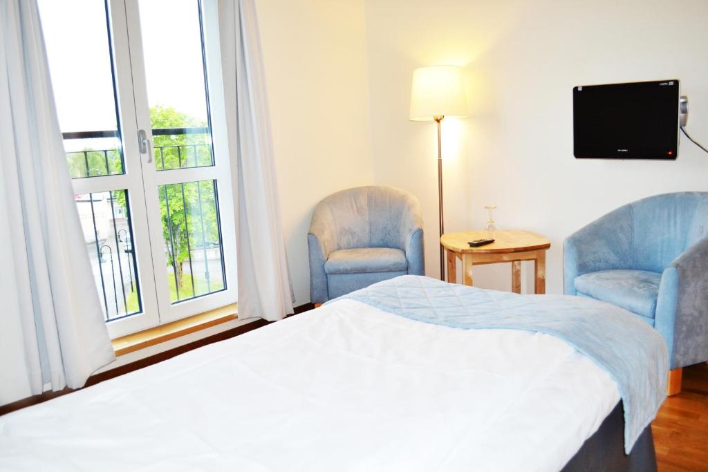 Postel nebo postele na pokoji v ubytování Hotell Årjäng